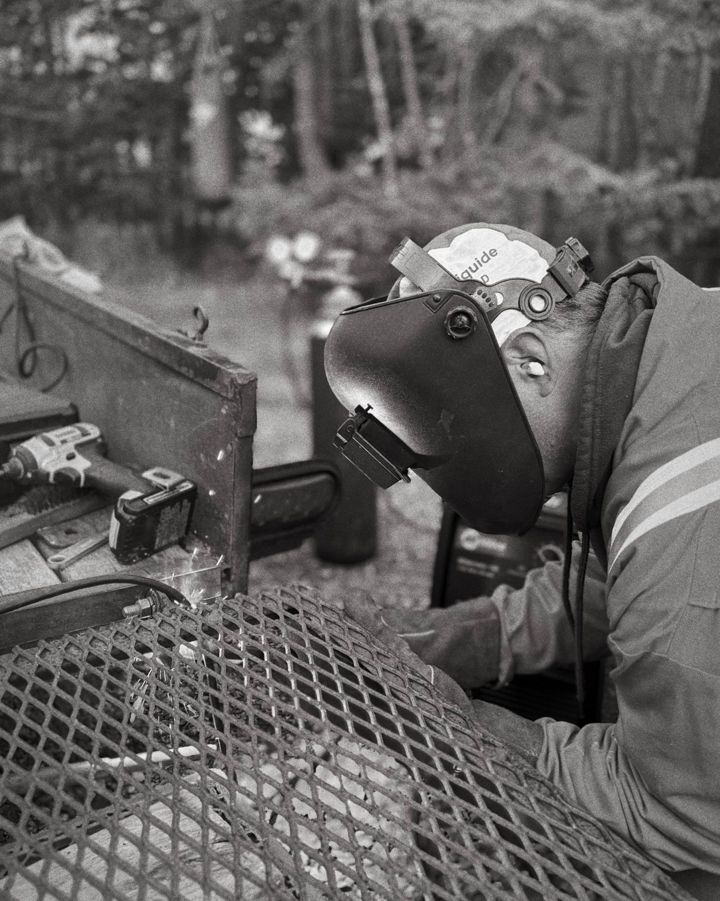 Welder at work, black and white